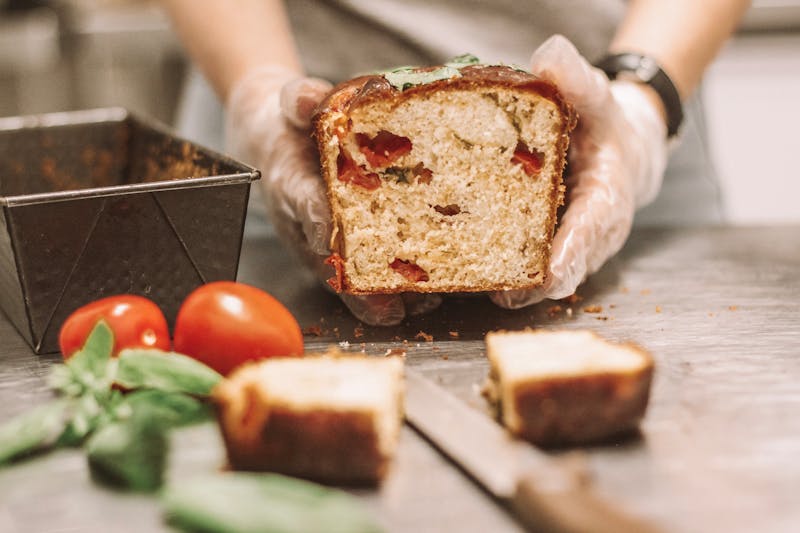 Chef preparing handcrafted pizza in Green Lantern kitchen